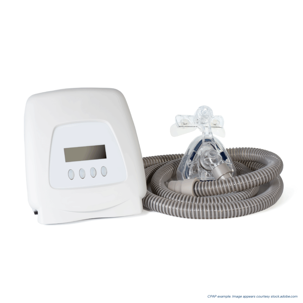 CPAP machine with attached hose and nasal mask on a white background, showing a standard setup used for treating obstructive sleep apnea.
