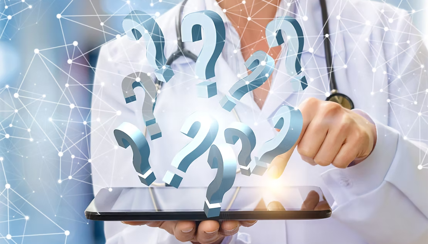 Healthcare professional holding a tablet with floating question mark icons over a digital network background.